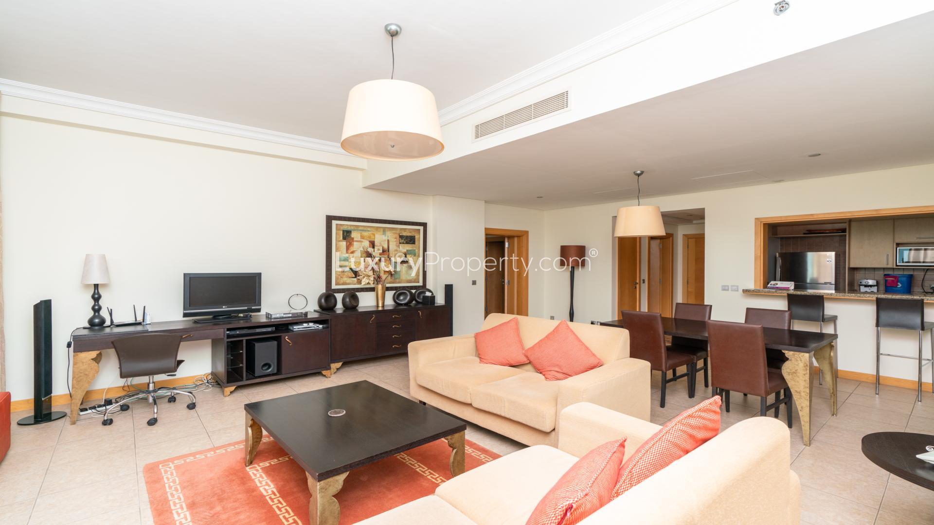 Bright living room in 1-bedroom beachfront apartment, Al Nabat, Palm Jumeirah, open-plan layout
