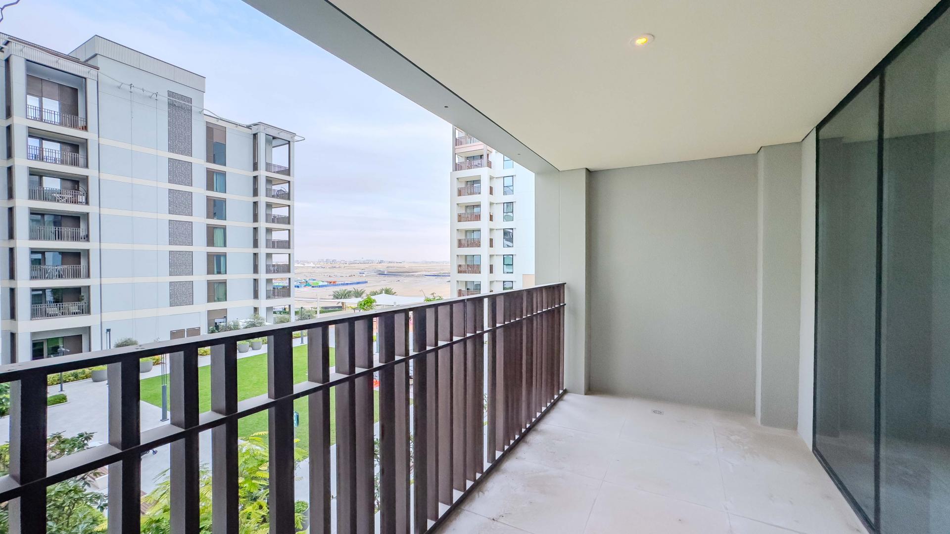 "Spacious living room with large windows in Dubai Creek Harbour apartment for rent.","Balcony view of park-facing apartment in Creek Beach, Dubai Creek Harbour, available for rent.",Brand new 1-bedroom apartment interior with balcony view, Dubai Creek Harbour, Creek Beach