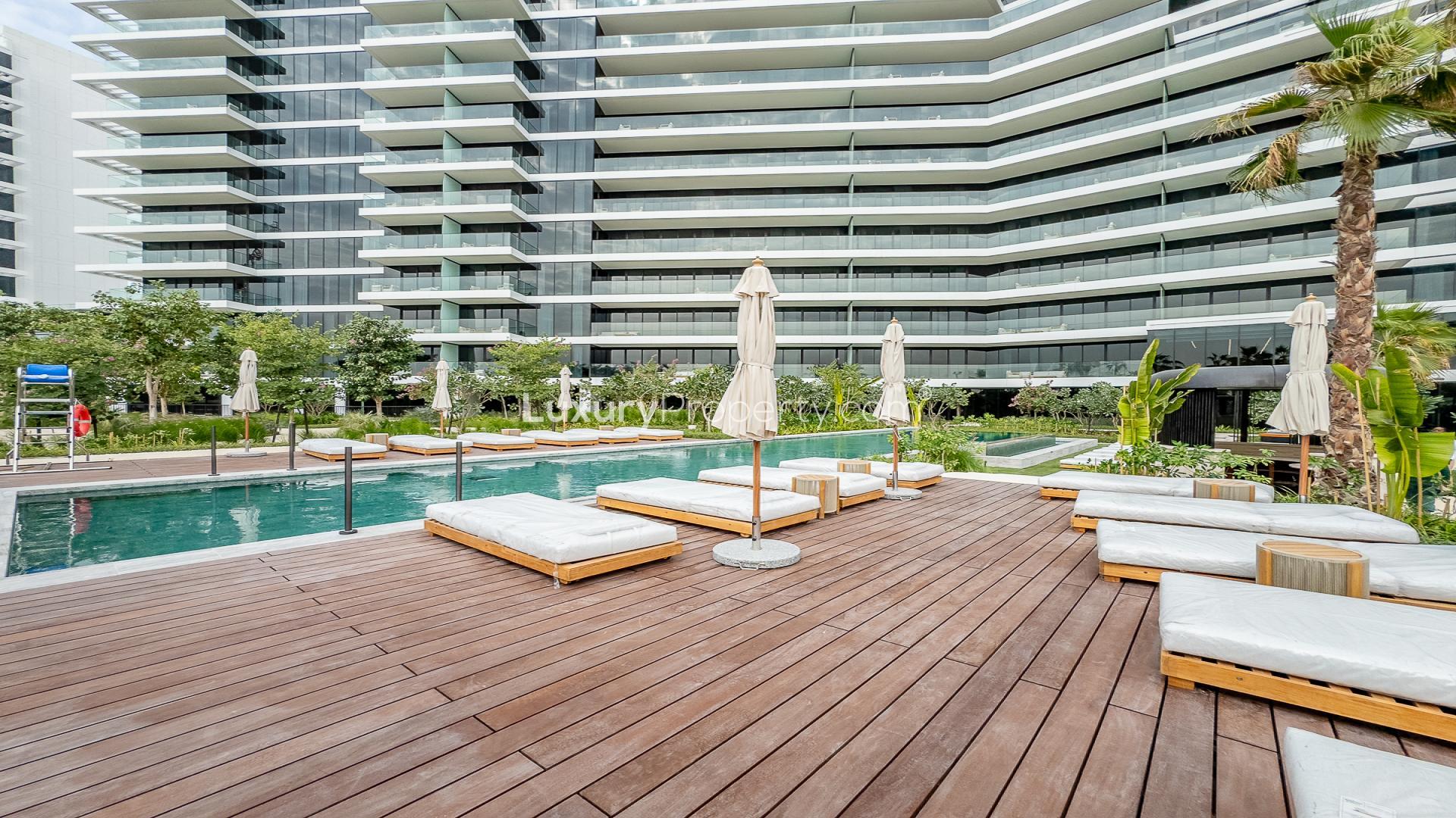 Outdoor pool area at Kempinski Residences The Creek, Al Jaddaf apartment for rent