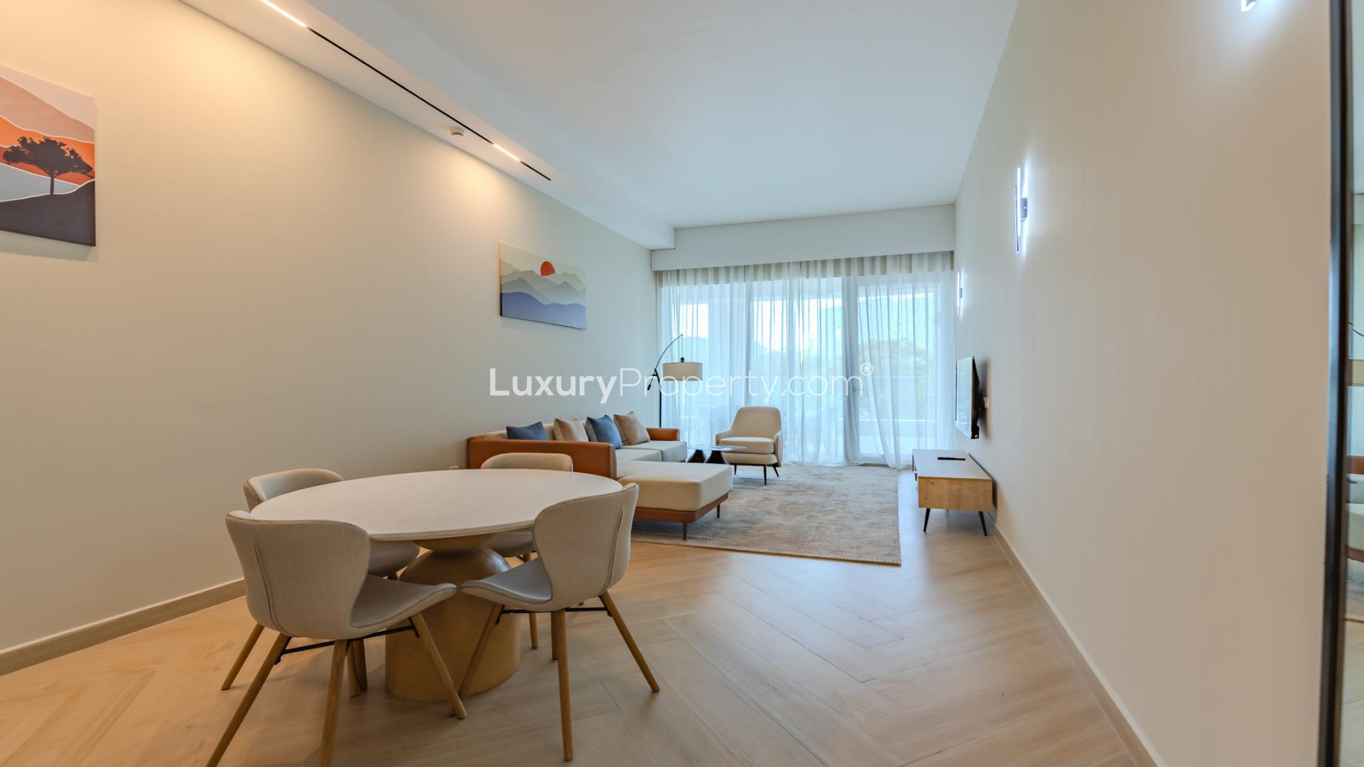 Immaculate furnished apartment living room in Al Sufouh 1, modern decor and open kitchen