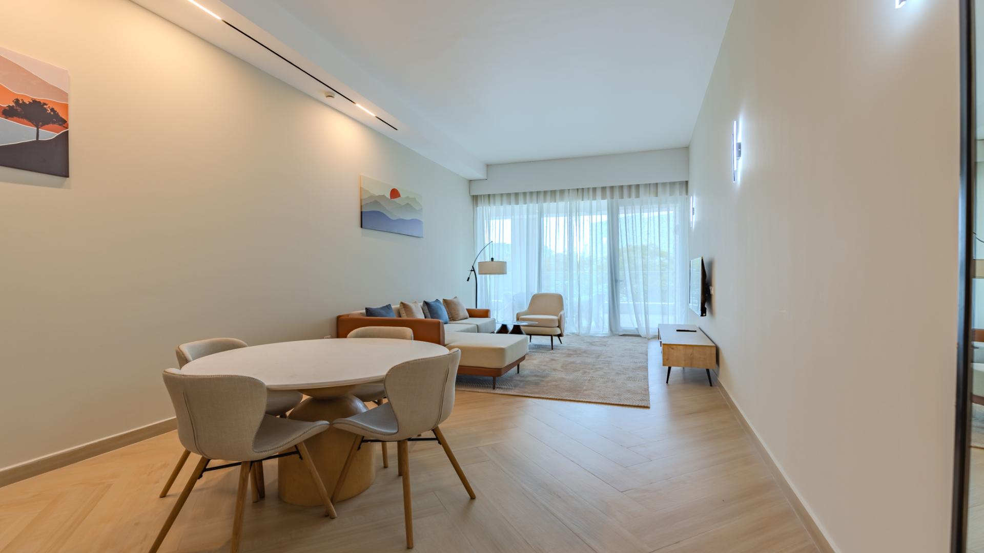 Immaculate furnished apartment living room in Al Sufouh 1, modern decor and open kitchen