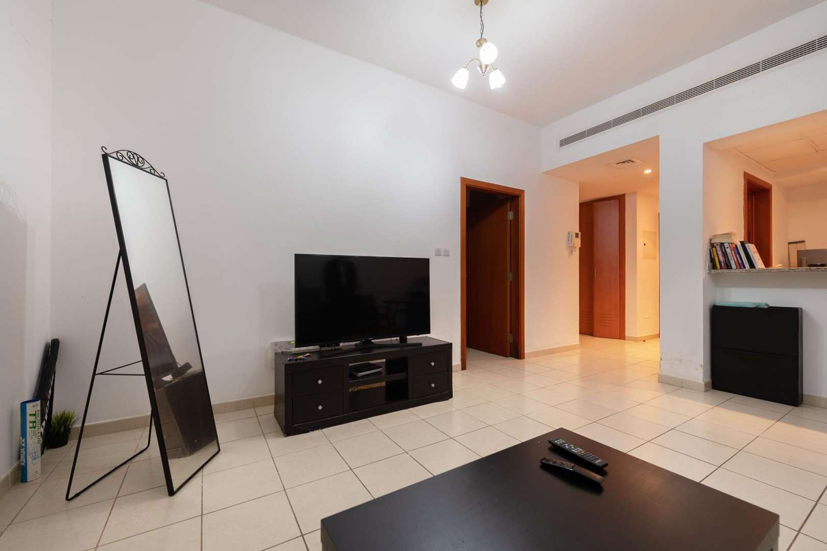 Cozy living room in 1-bedroom apartment, Al Thayyal, The Greens, tiled floor, modern furnishings