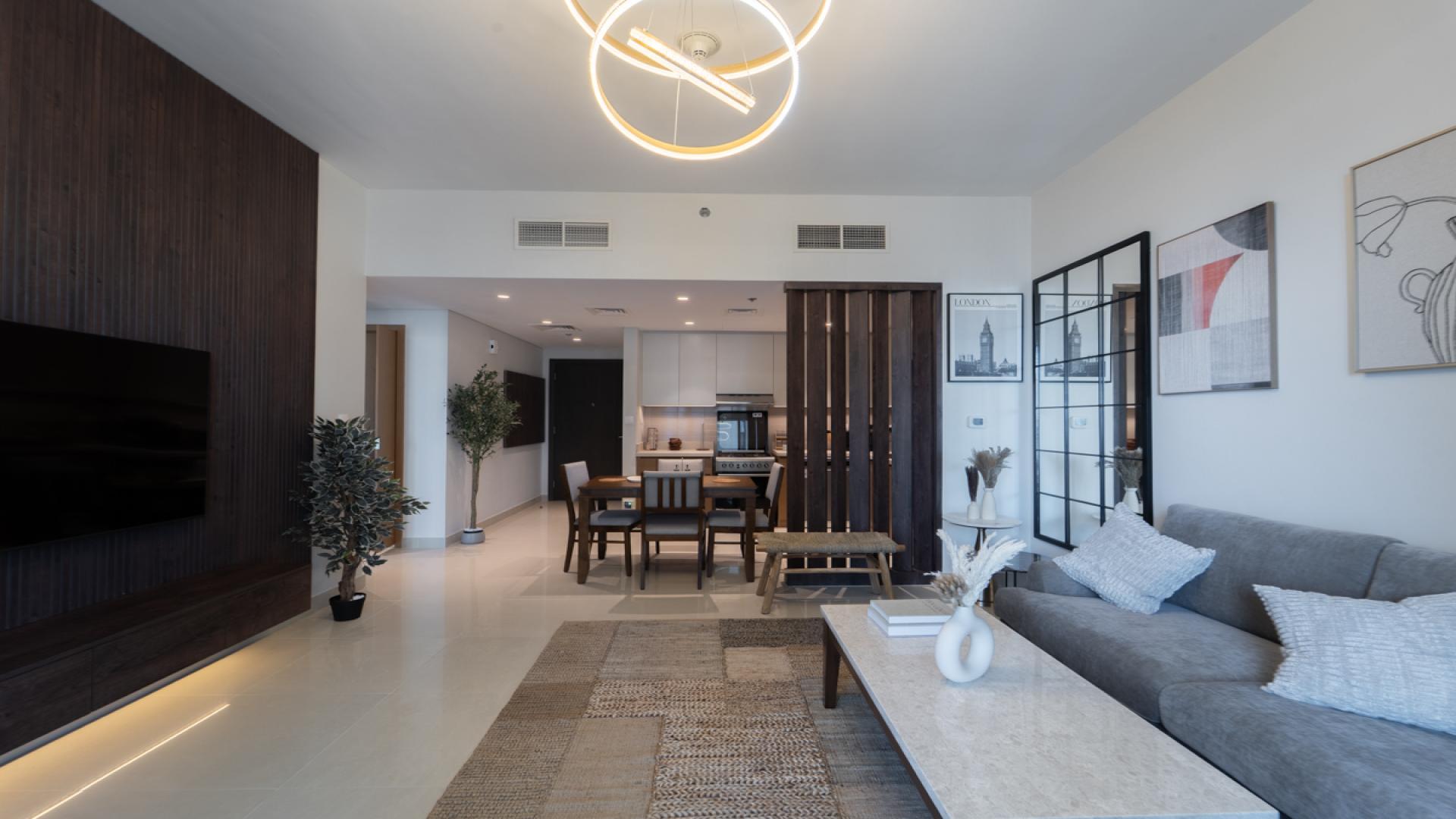 Modern living room in Harbour Views 1 apartment, Dubai Creek Harbour, with cityscape view