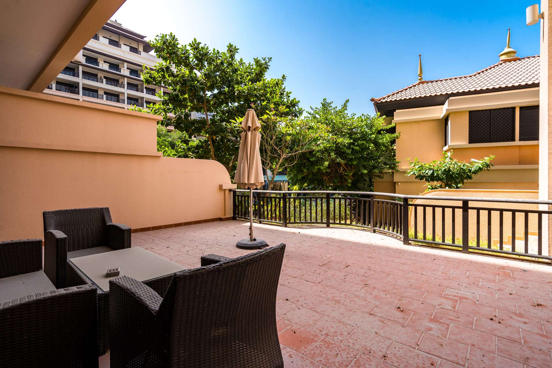 Modern kitchen with dark wood cabinets in Palm Jumeirah apartment, Anantara Residences