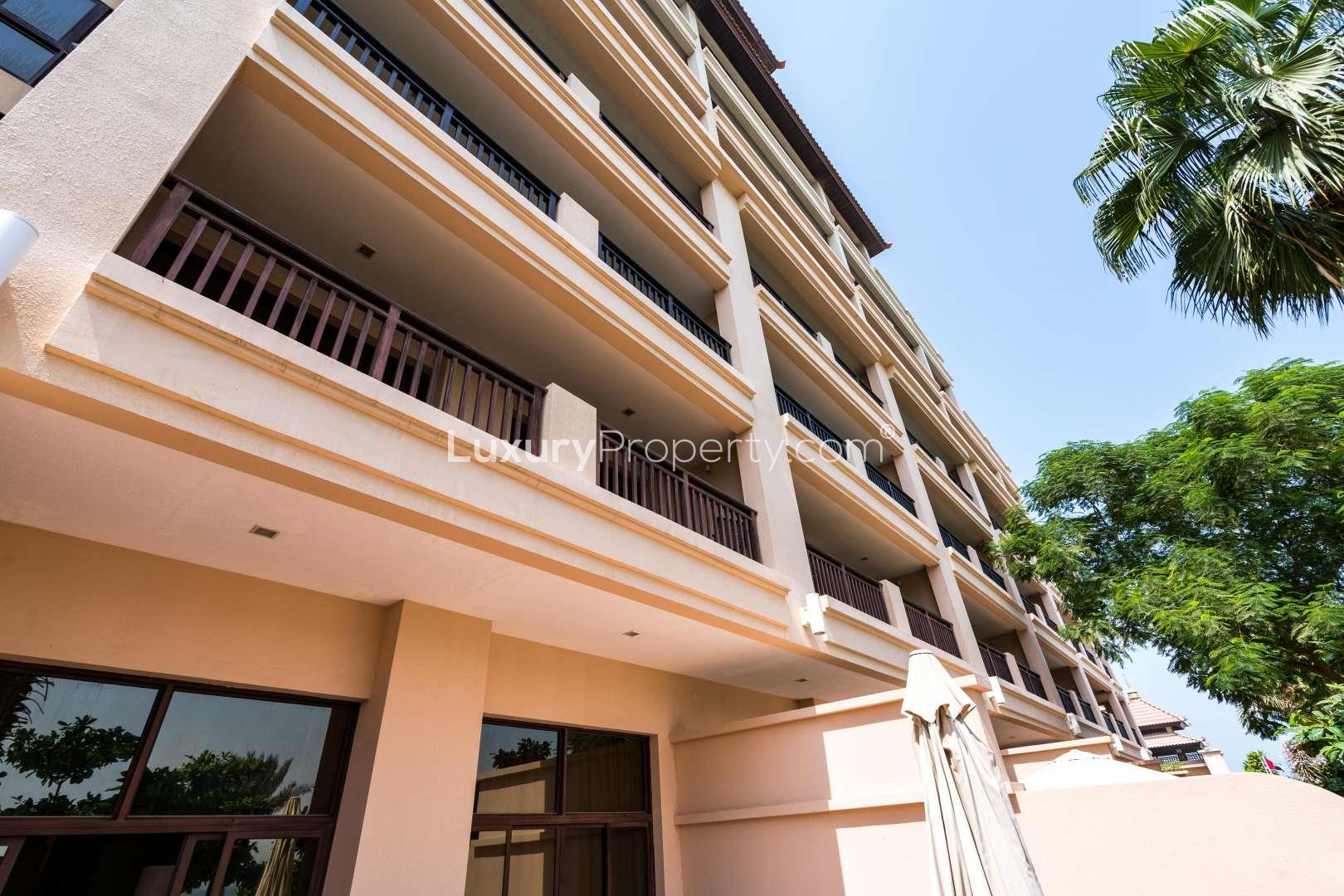 Aerial view of Anantara Residences, Palm Jumeirah with pool and sea backdrop