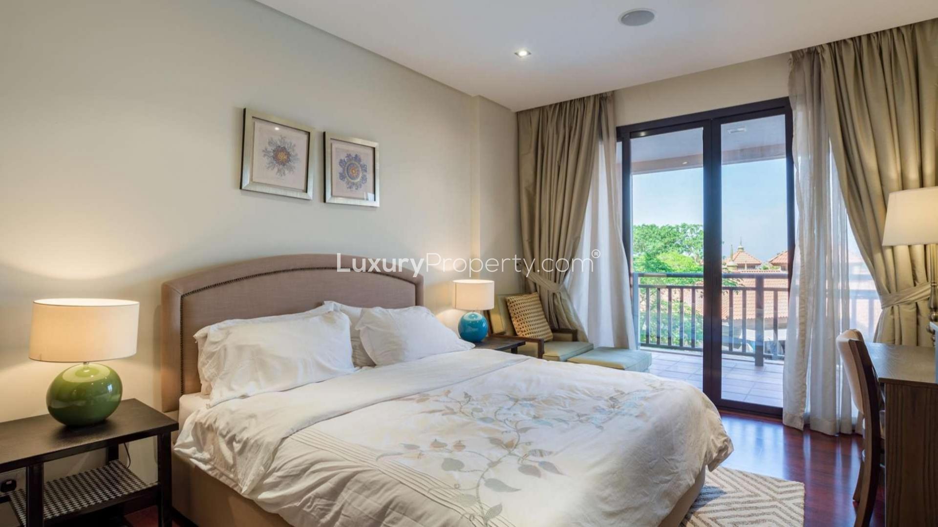 One-bedroom apartment interior with balcony view in Anantara Residences, Palm Jumeirah
