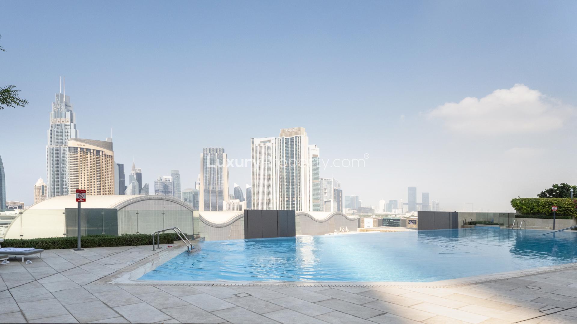 Fully furnished 1-bedroom apartment interior in Boulevard Point, Downtown Dubai, with city view