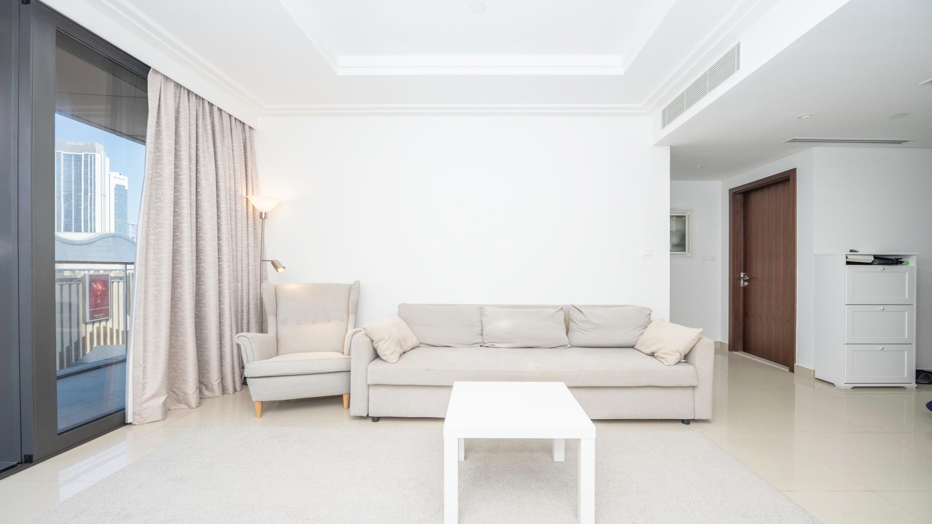 Rooftop pool view at Boulevard Point apartment in Downtown Dubai, skyline in background
