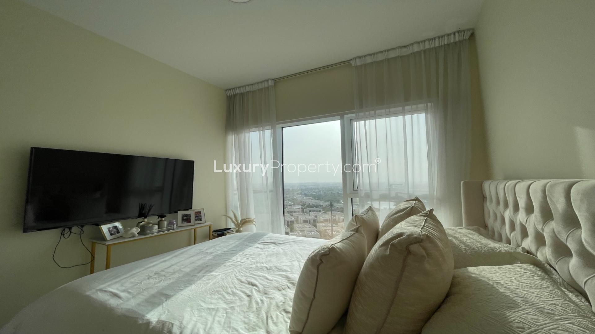 Cozy bedroom in Damac Hills apartment, Golf Vita, with modern decor and natural light