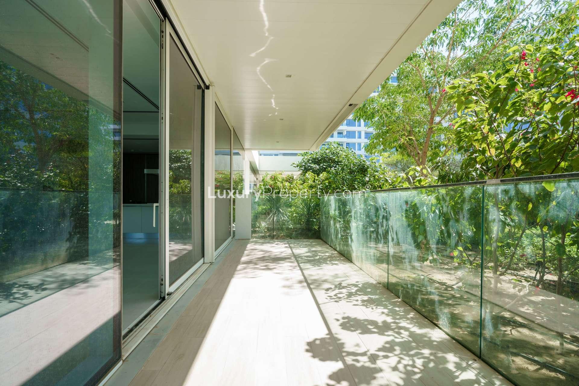 Spacious living room with large windows in luxury Ashjar apartment, Al Barari