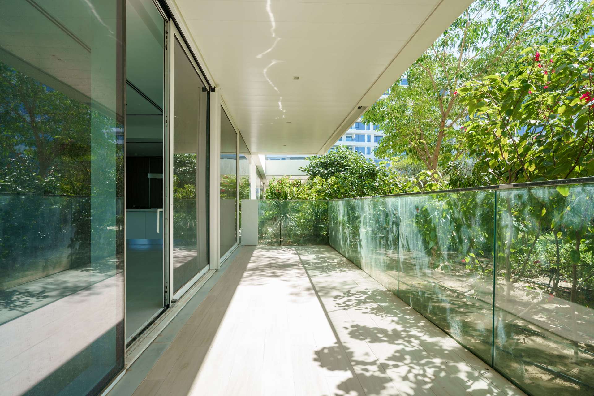 Spacious living room with large windows in luxury Ashjar apartment, Al Barari