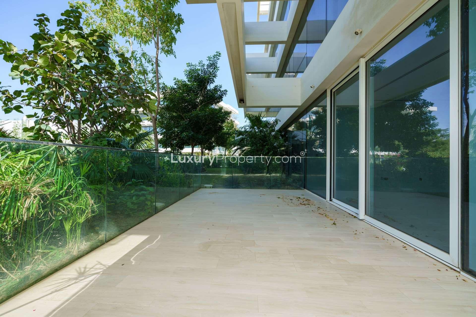 Spacious modern kitchen with large windows in luxury Ashjar apartment, Al Barari for rent