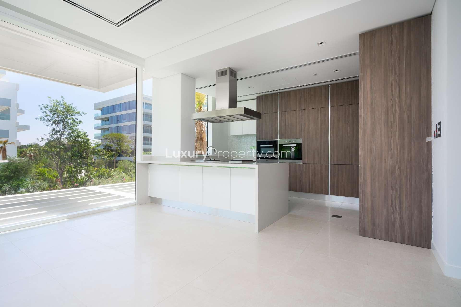 Spacious balcony view from 1-bedroom apartment in Ashjar, Al Barari, surrounded by greenery