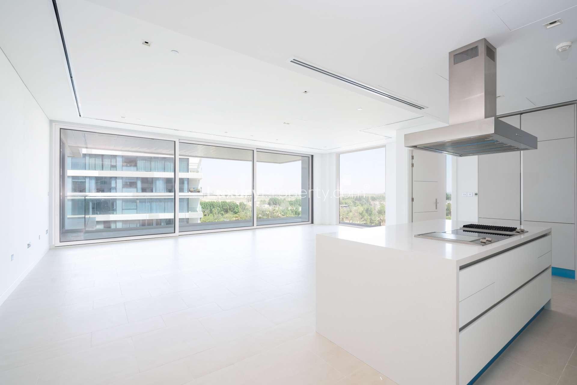 Bright living area with large windows in Ashjar, Al Barari 1-bedroom apartment for rent