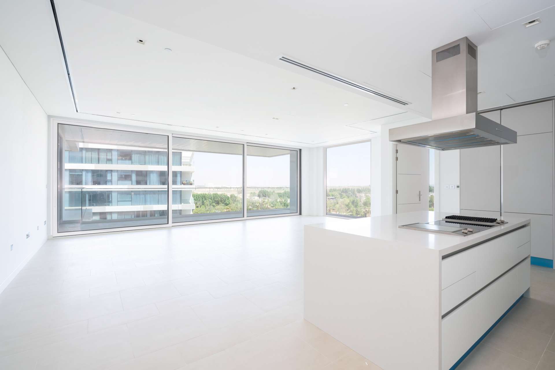 Bright living area with large windows in Ashjar, Al Barari 1-bedroom apartment for rent