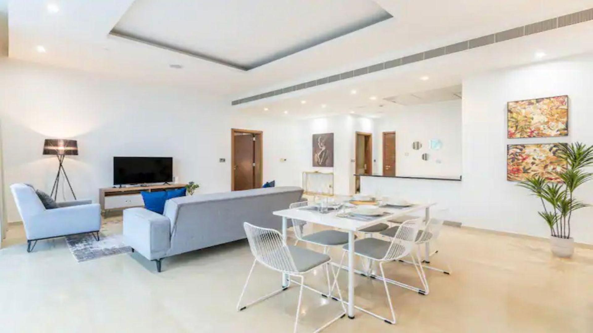 Balcony view of Oceana Baltic apartment with garden and pool on Palm Jumeirah