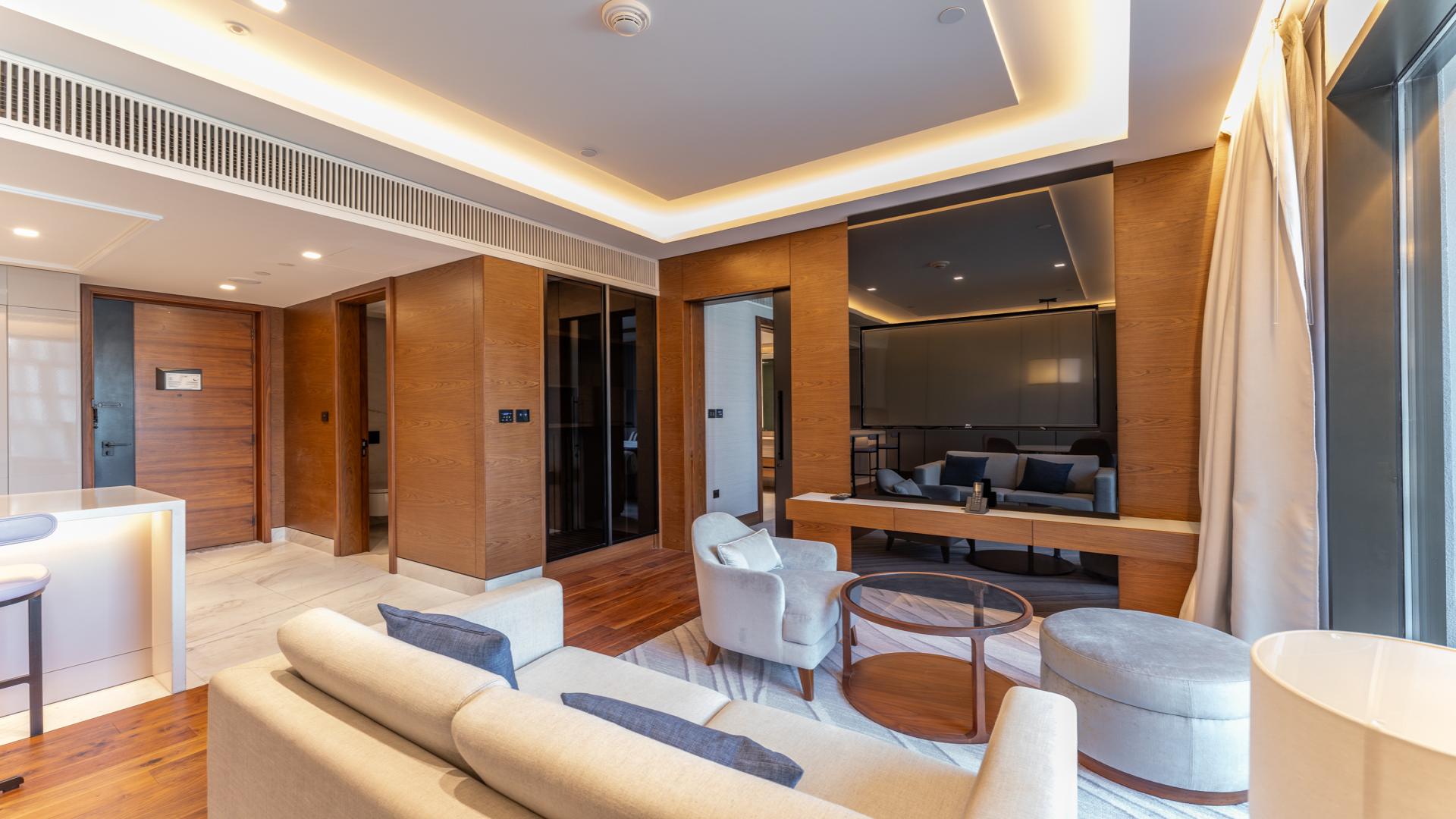 Modern apartment complex with pool view at Caesars Bluewaters Dubai, near the sea