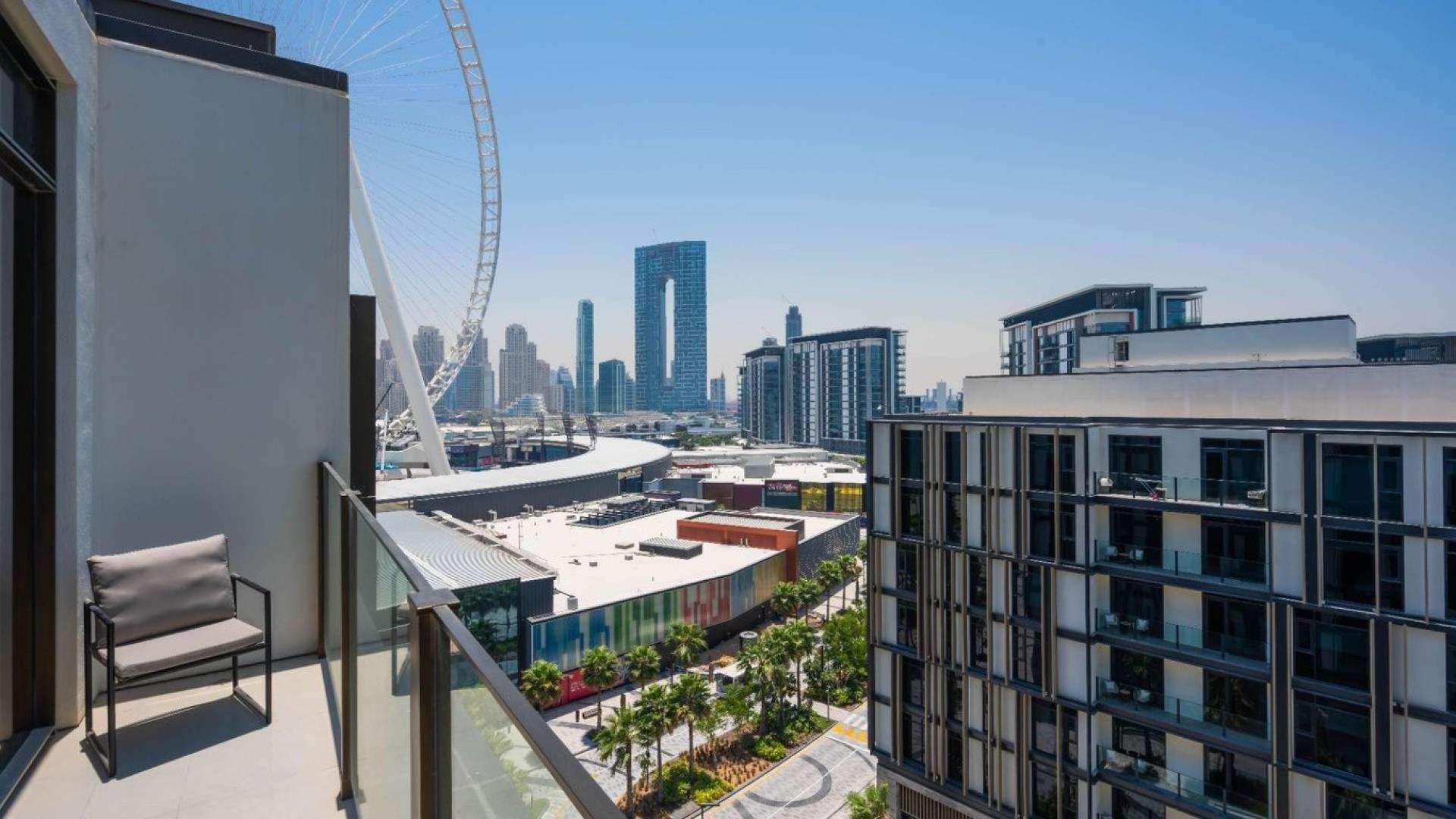 Modern living room in fully furnished Bluewaters Island apartment, featuring elegant decor and natural light