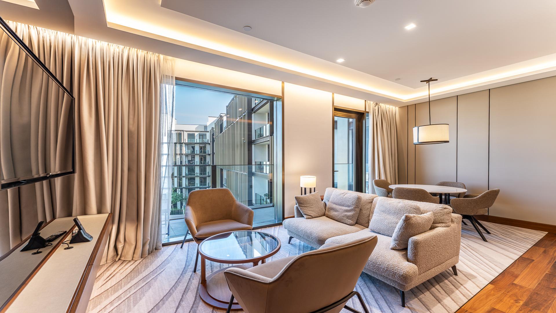 Luxurious living room in Caesars Bluewaters Dubai apartment with modern furnishings and sea view