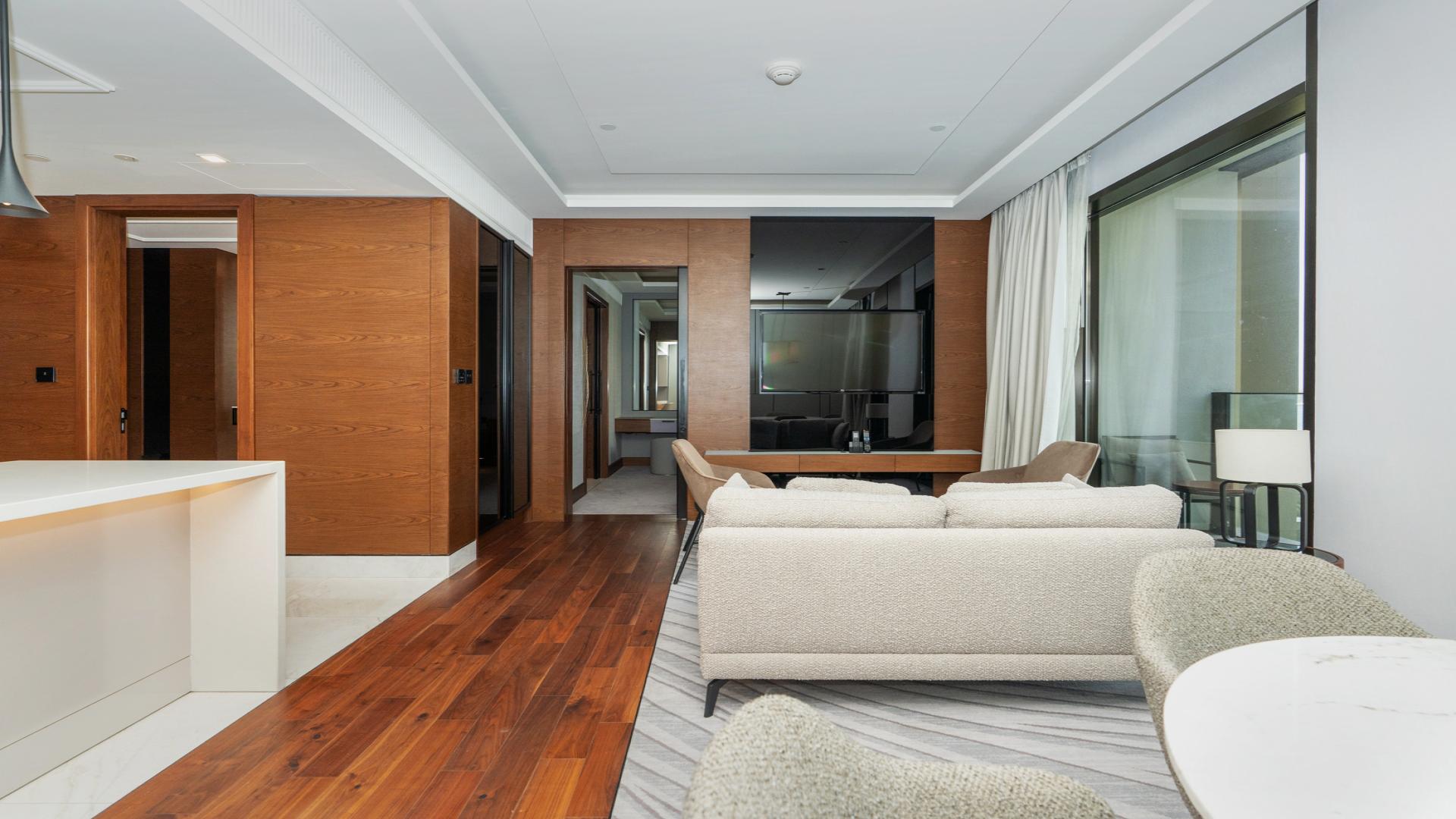 Modern living area in 1-bedroom apartment, Bluewaters, Dubai. Open layout with stylish furnishings
