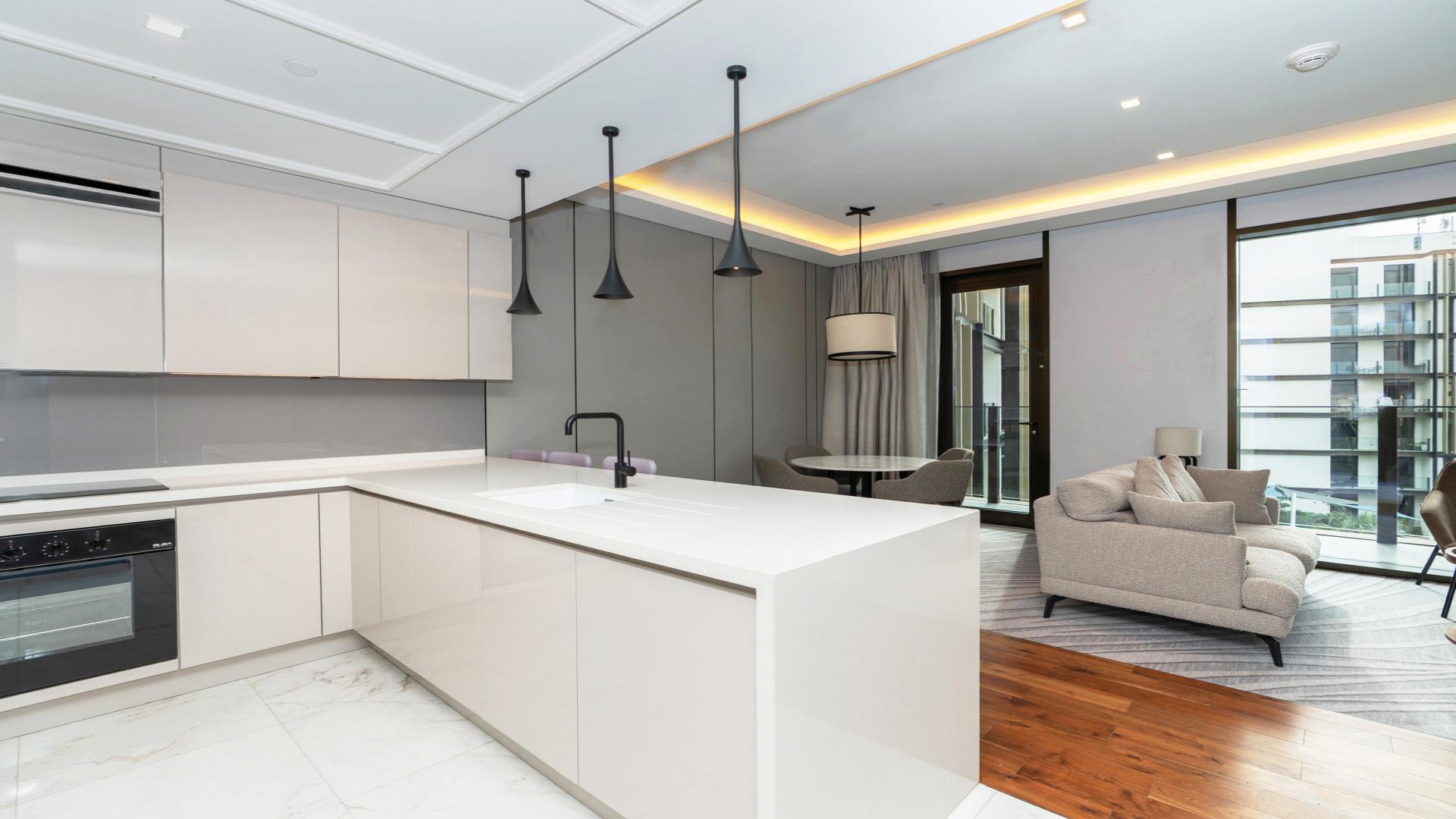 Modern living area in Caesars Bluewaters Dubai apartment with stylish furnishings and natural light