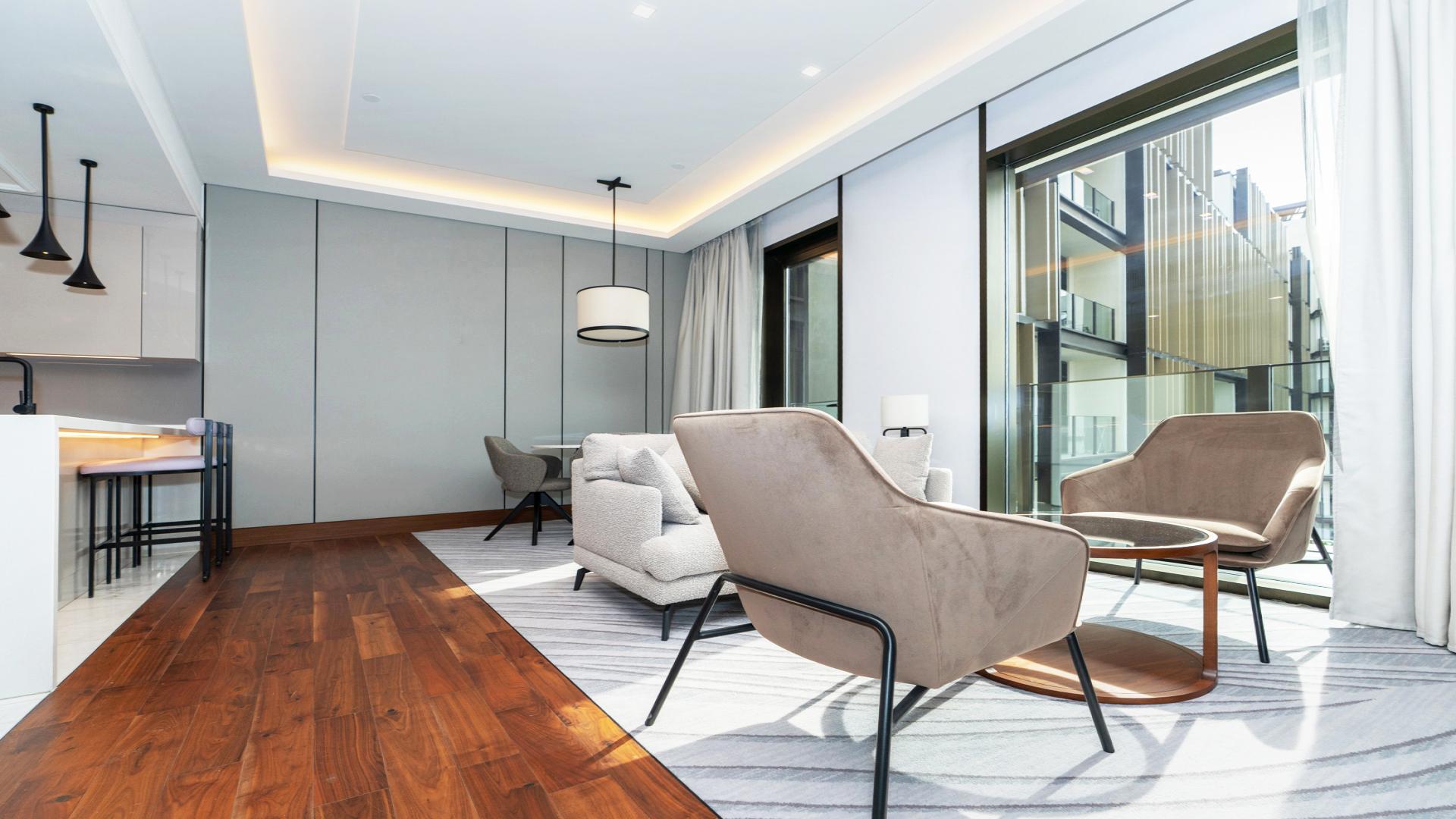 Modern kitchen and living area in Bluewaters Caesars apartment, Dubai, LP47838