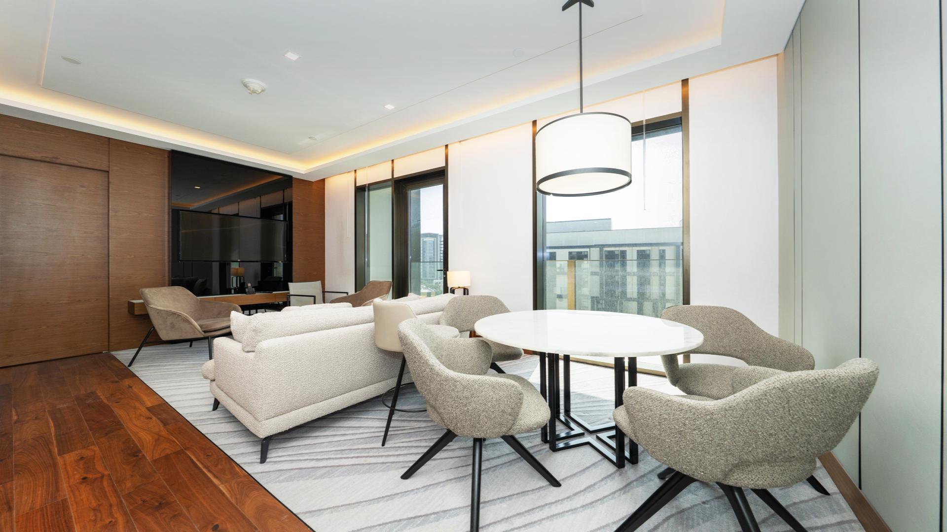 Modern open-plan living room and kitchen in Caesars Bluewaters Dubai apartment for rent