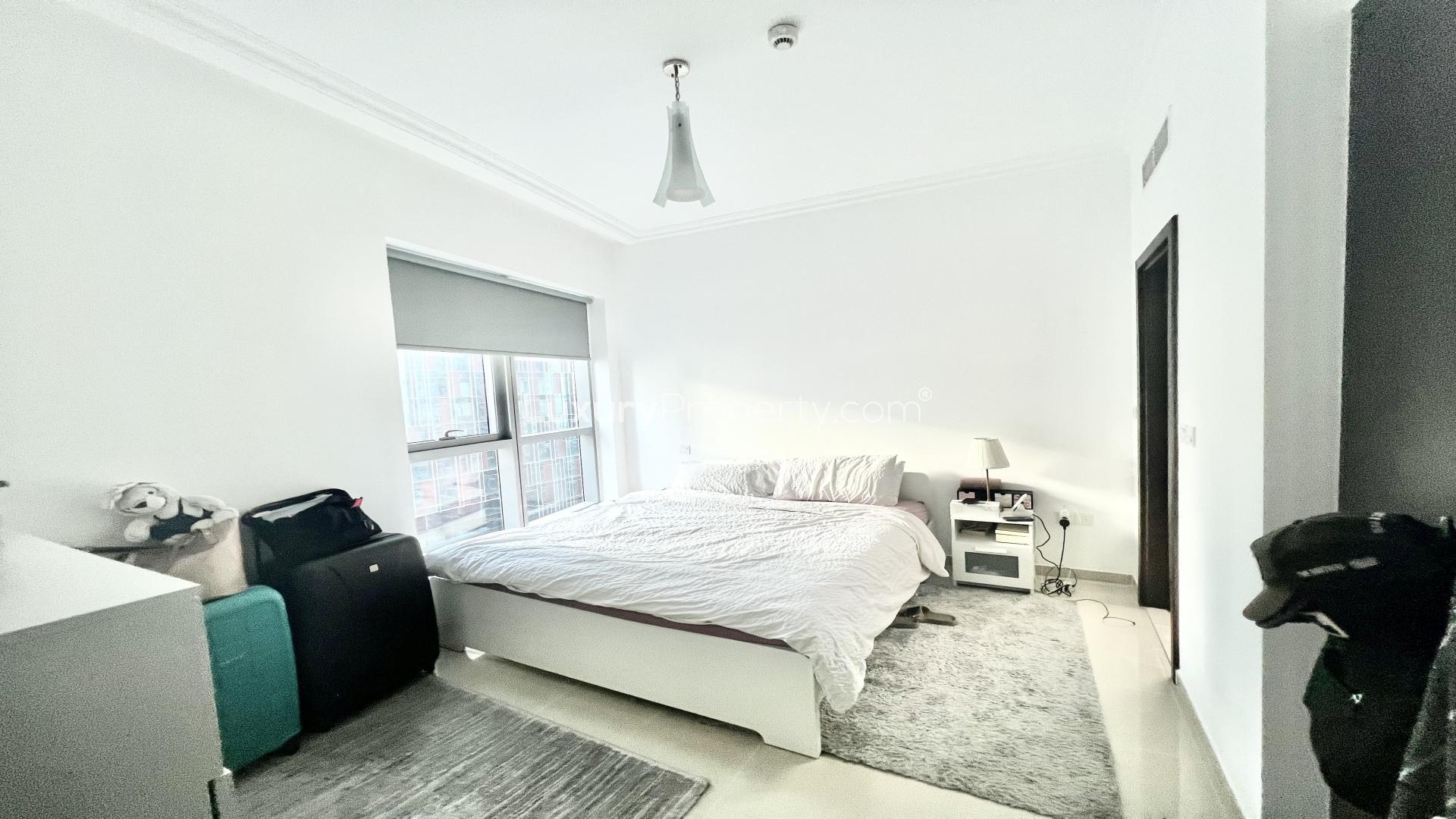 Bright living room in Bay Central apartment, Dubai Marina, with modern decor and partial sea view