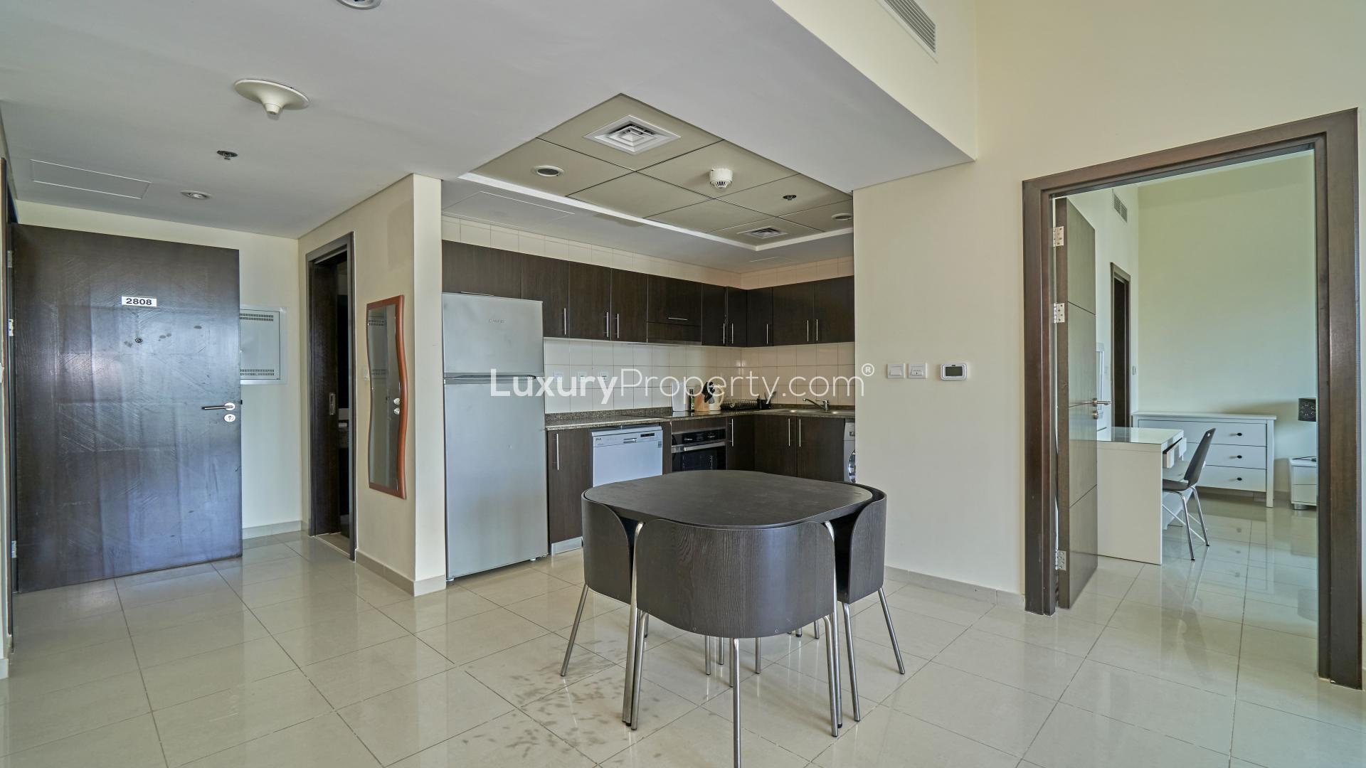 Modern kitchen and dining area in Bay Central apartment, Dubai Marina, available for rent