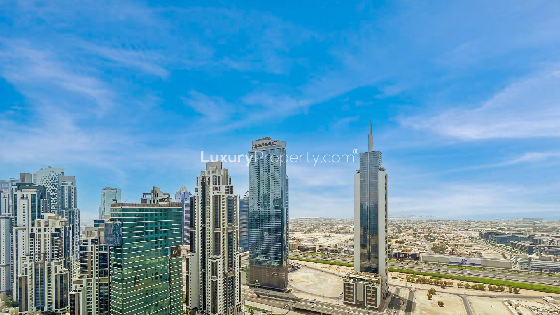 Bright kitchen and living area in Downtown Dubai apartment with city views