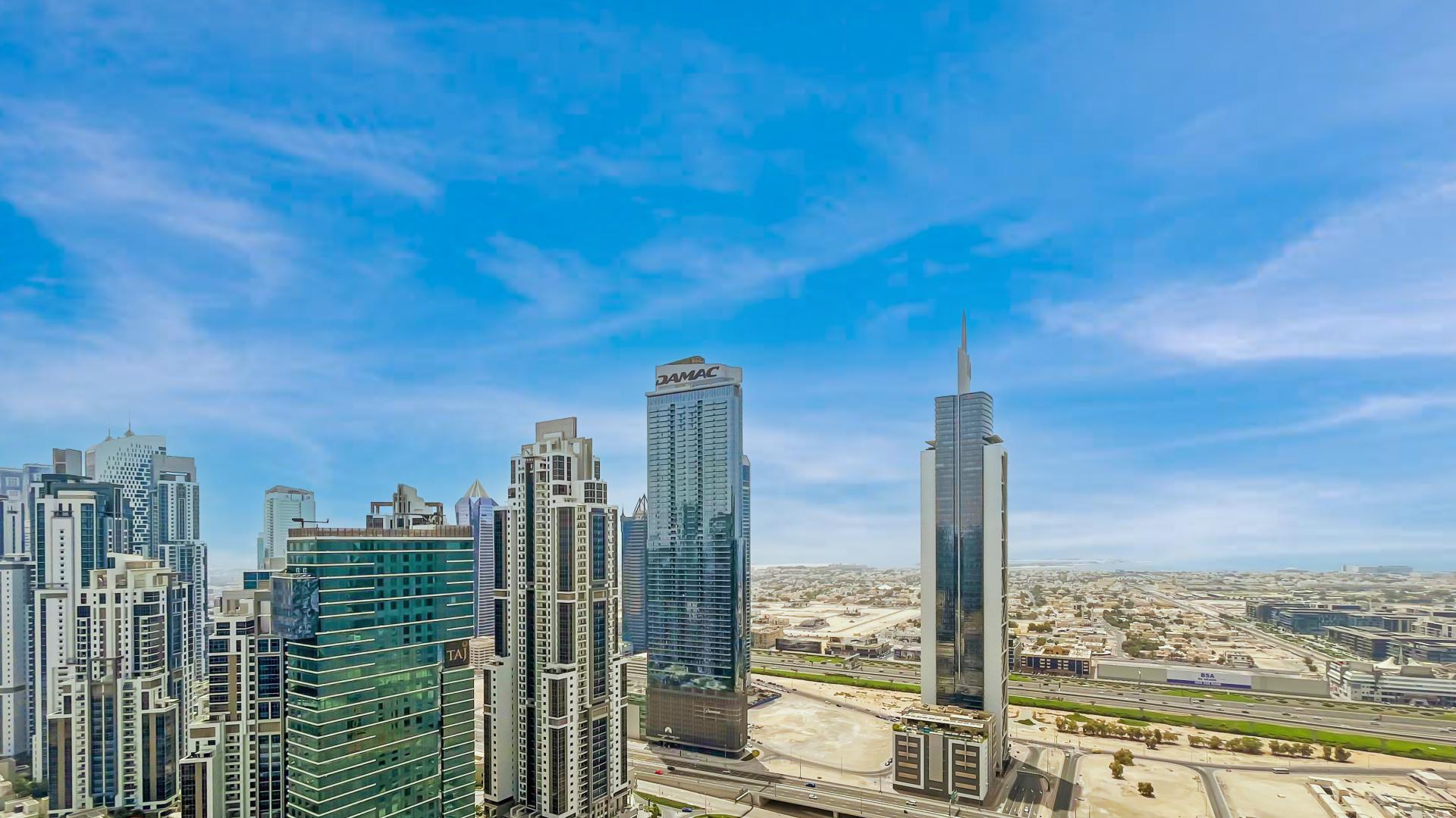 Bright kitchen and living area in Downtown Dubai apartment with city views