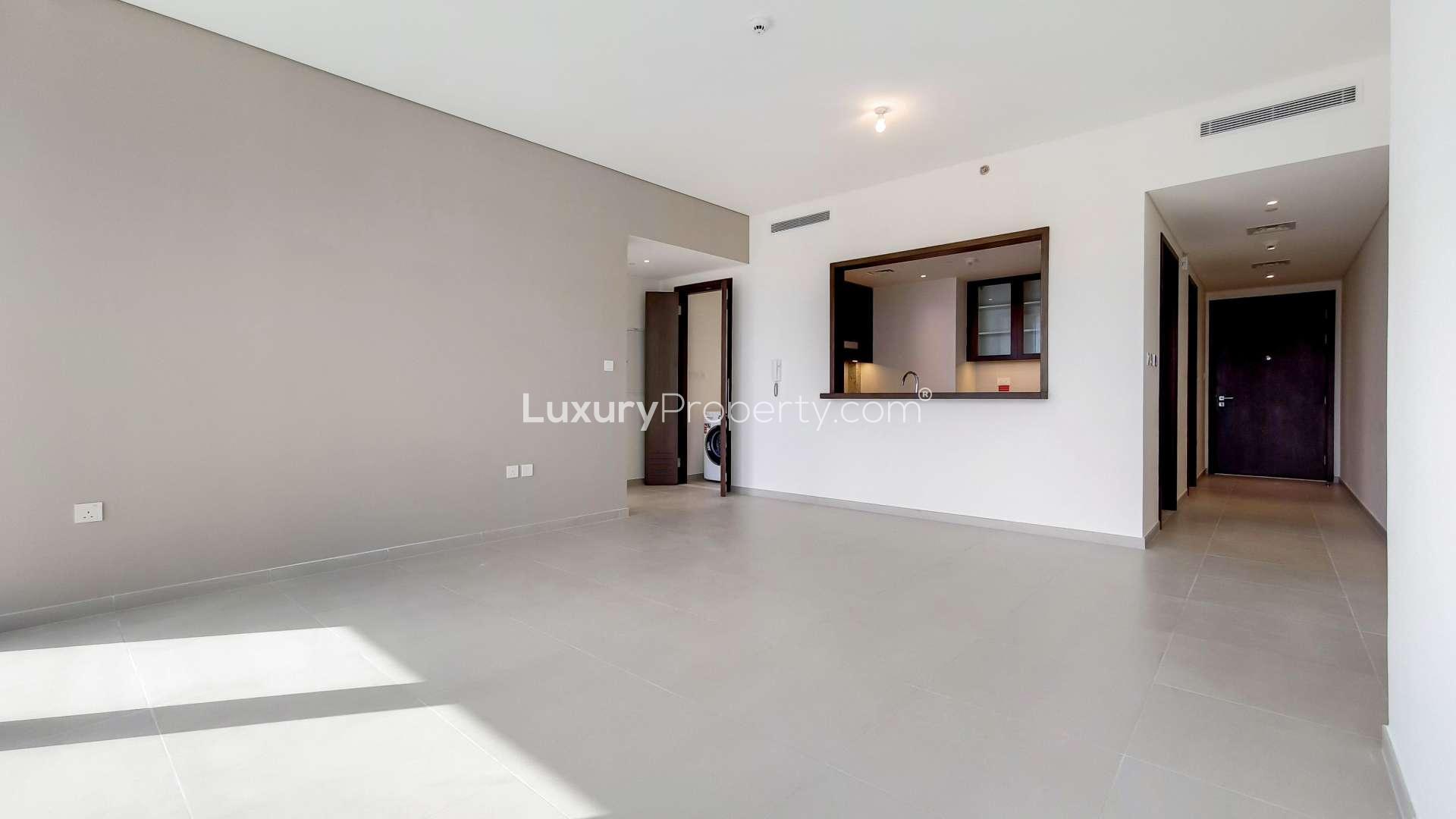 Spacious living area with large windows in BLVD Heights apartment, Downtown Dubai