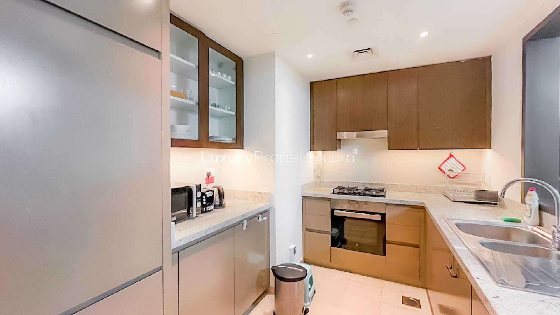 Fully furnished living room with balcony view in BLVD Heights, Downtown Dubai apartment