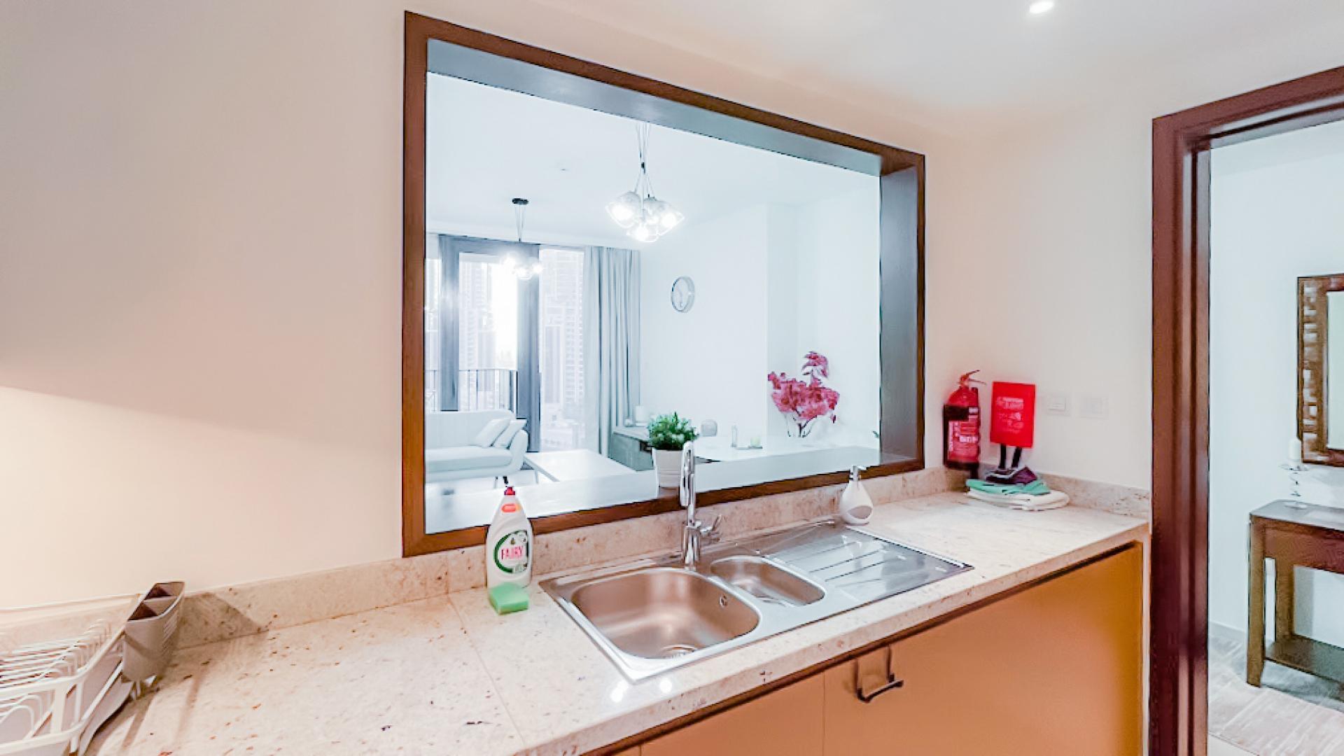 Modern kitchen in fully furnished 1-bed apartment, BLVD Heights, Downtown Dubai