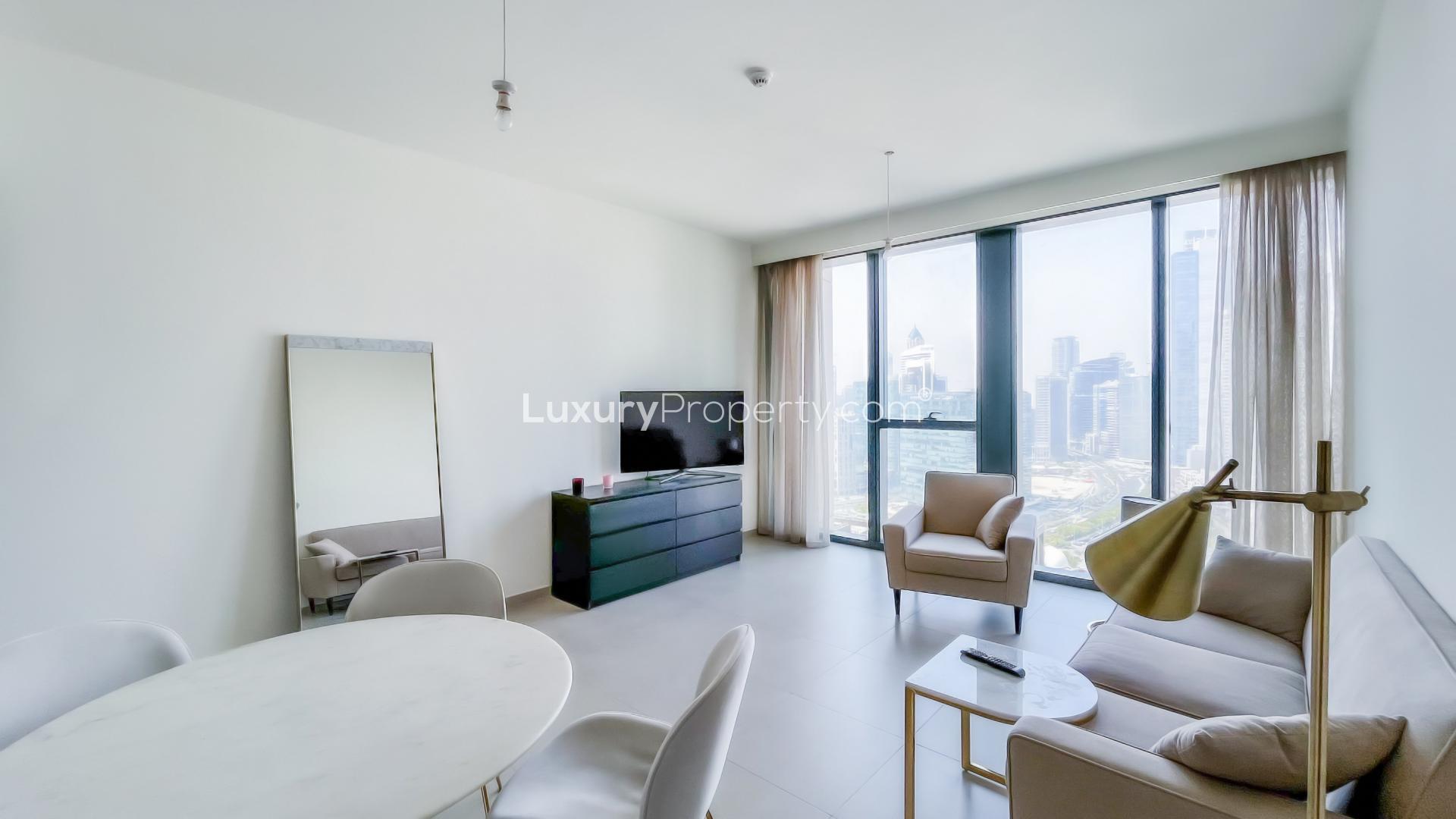 N/A,Furnished living room in 1-bedroom apartment, BLVD Heights, Downtown Dubai, city view