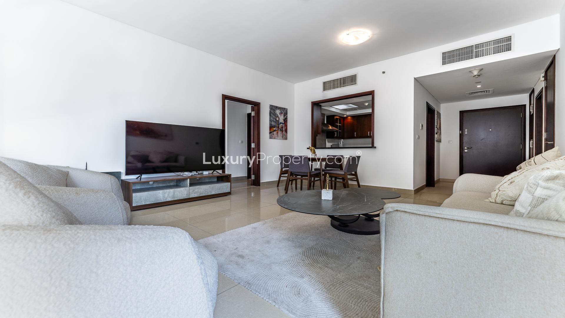 Modern living room in 1-bedroom apartment at 29 Burj Boulevard, Downtown Dubai for rent