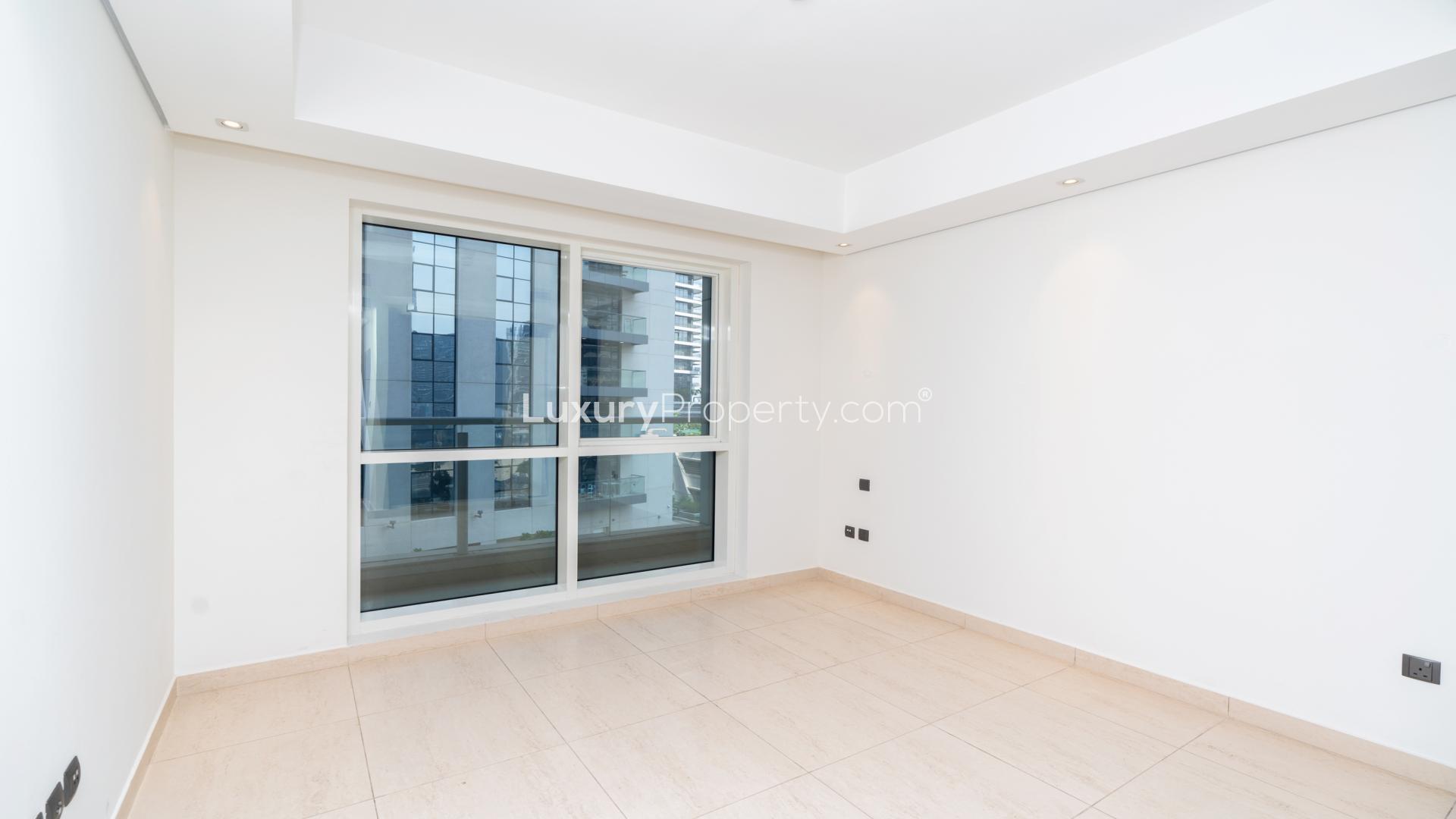 Modern kitchen and living area in luxury 1-bedroom apartment, Mon Reve, Downtown Dubai