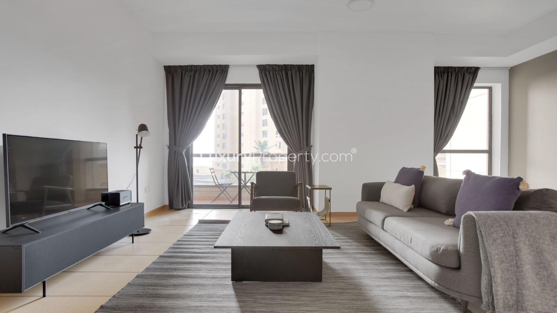 Modern kitchen in unfurnished 1-bedroom JBR apartment, featuring sleek cabinetry and appliances