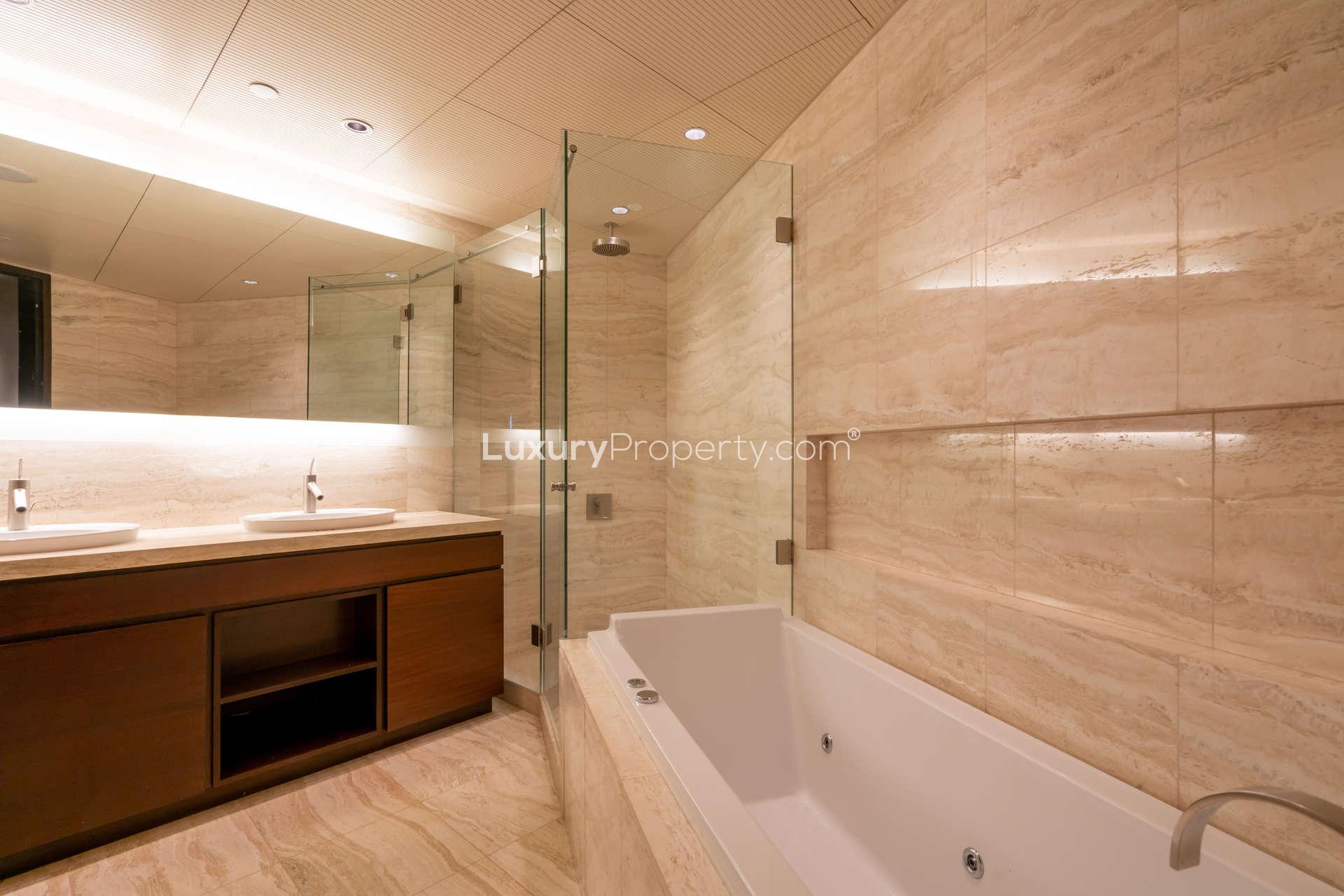 Modern kitchen in 1-bedroom Burj Khalifa apartment, featuring sleek countertops and stainless steel appliances