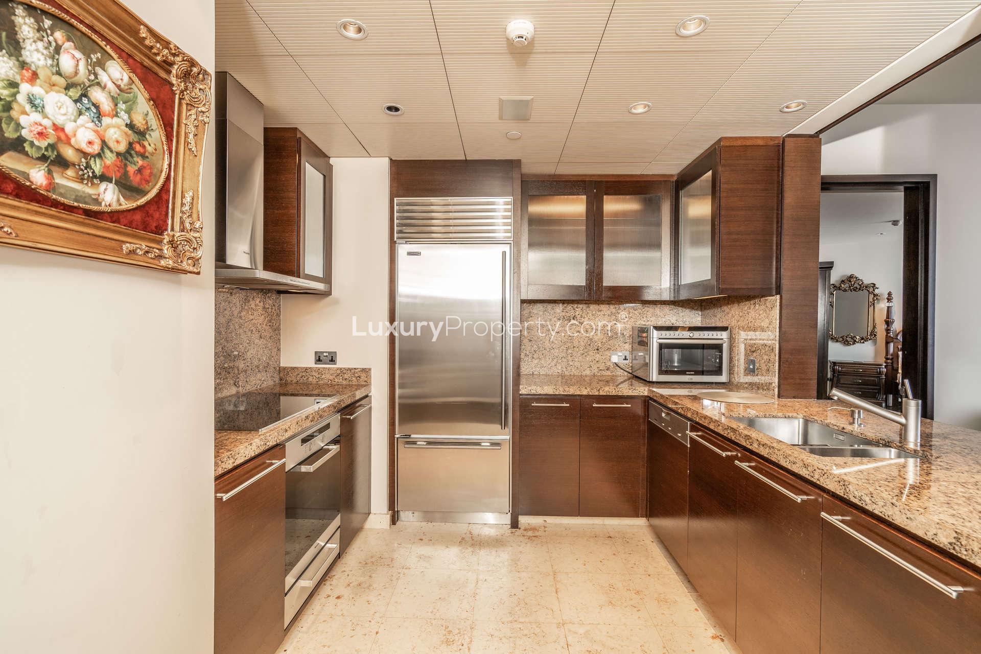 "Elegant hallway in Burj Khalifa apartment, Downtown Dubai, for rent with Opera view.",Modern kitchen in 1-bedroom apartment, Burj Khalifa, Downtown Dubai, luxury finishes, granite countertops