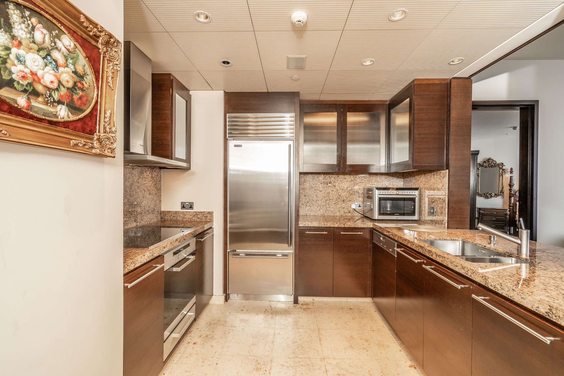 "Elegant hallway in Burj Khalifa apartment, Downtown Dubai, for rent with Opera view.",Modern kitchen in 1-bedroom apartment, Burj Khalifa, Downtown Dubai, luxury finishes, granite countertops