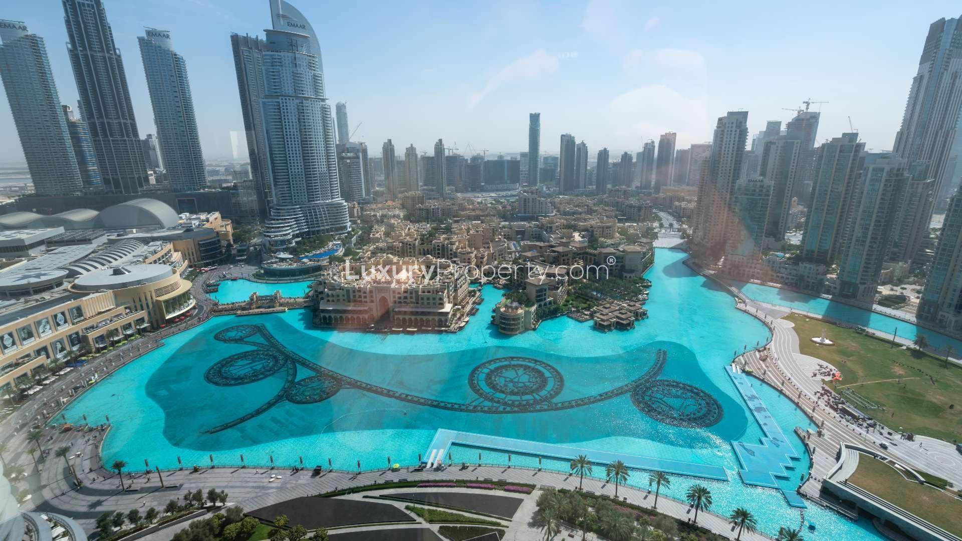 "Spacious Burj Khalifa apartment with modern kitchen and stunning Dubai Fountain views for rent.",Dubai Fountain view from Burj Khalifa apartment in Downtown Dubai, available for rent