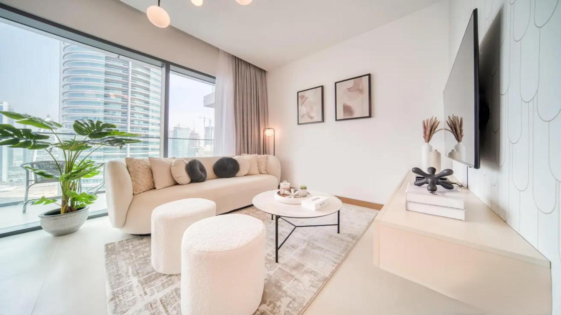 Modern living room in 1-bedroom apartment, Vida Residences, Dubai Marina. Bright, stylish interior design