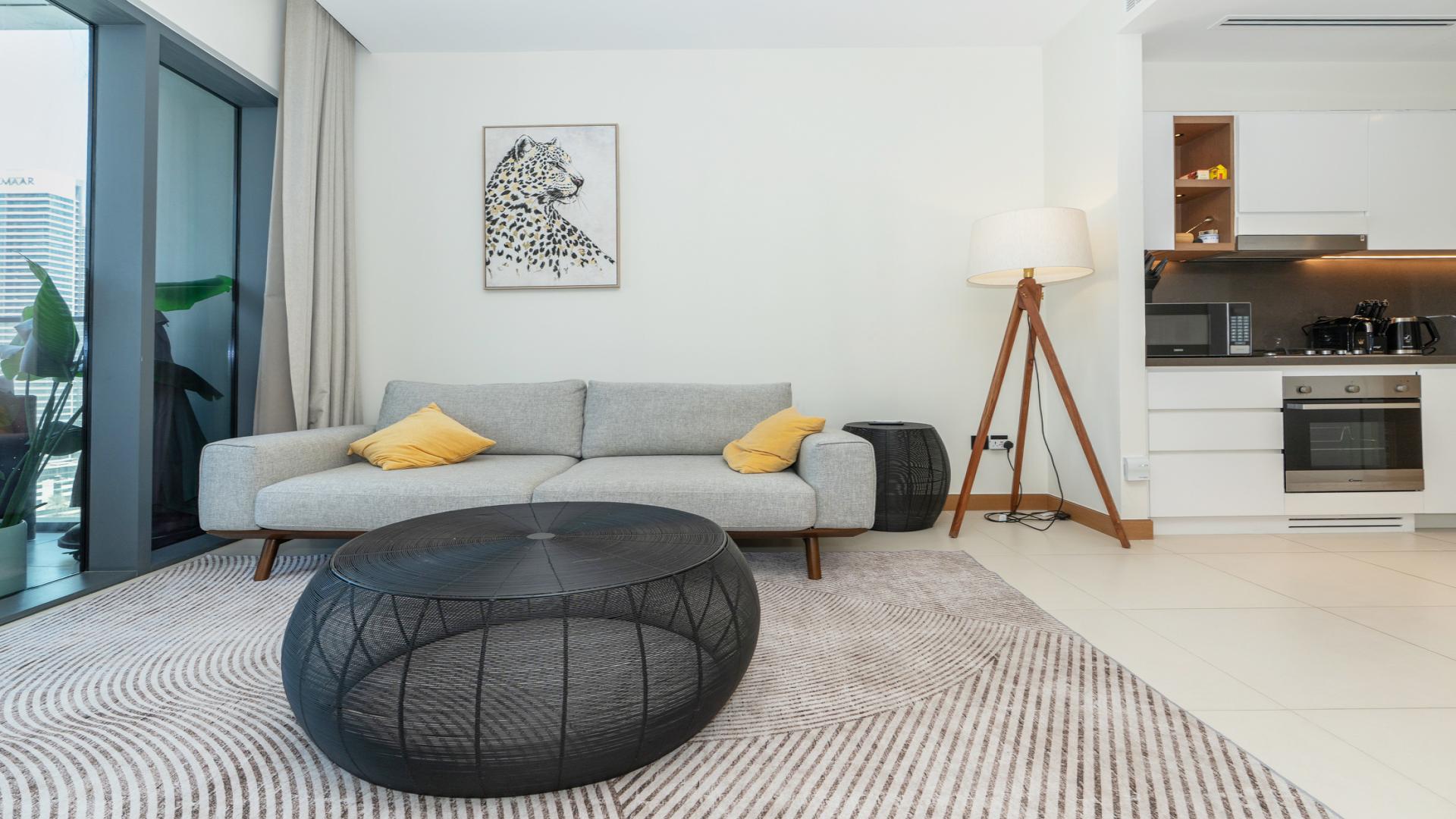 Mid-floor apartment living room with waterfront views, Vida Residences Dubai Marina, for rent