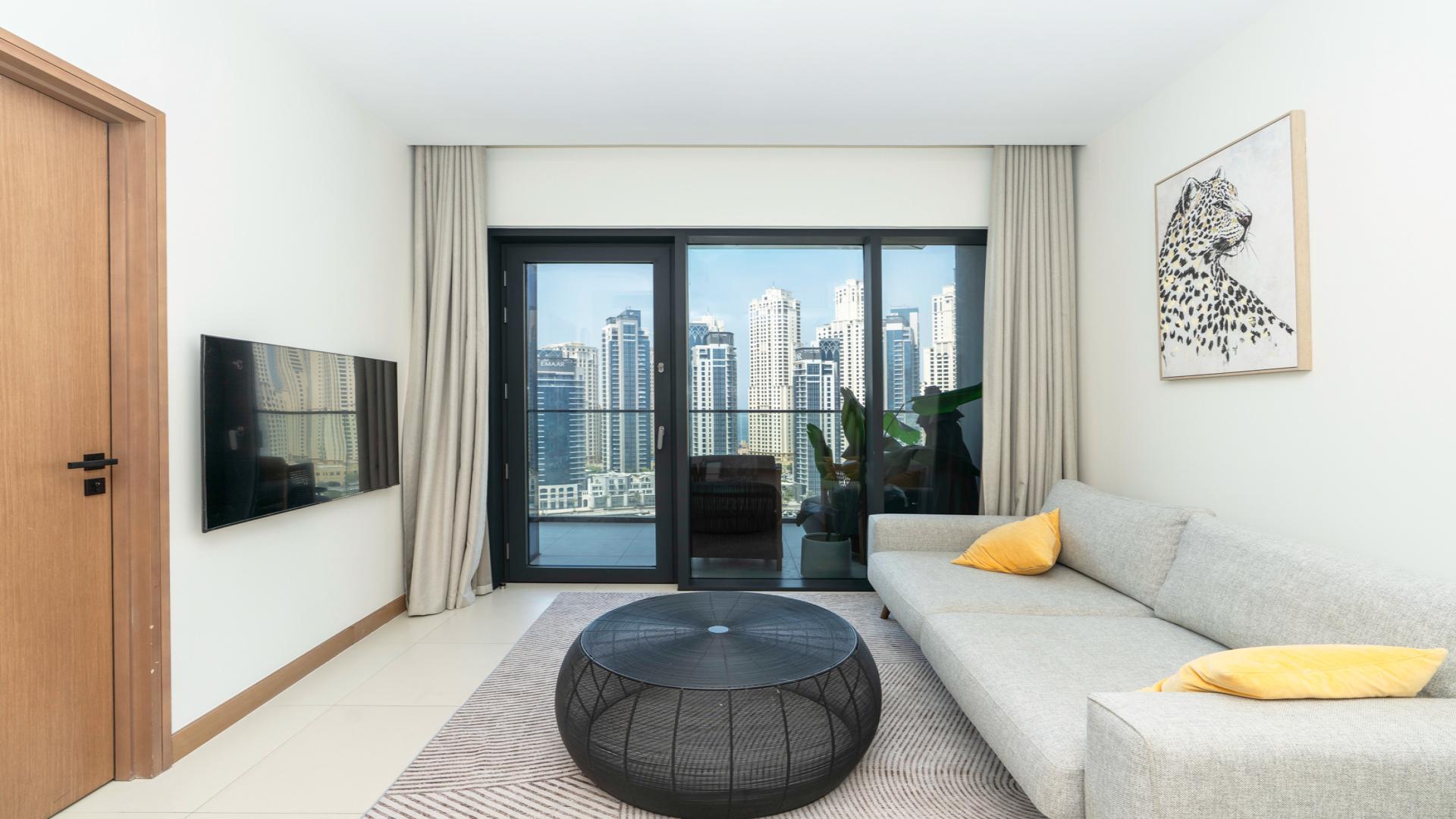Dubai Marina apartment view with waterfront, yachts, and skyline from Vida Residences balcony