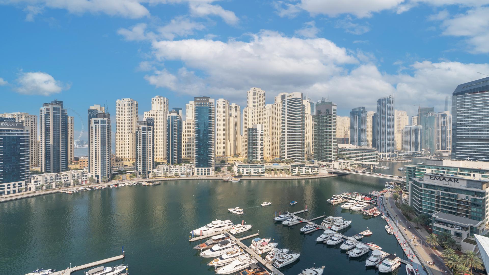 Modern kitchen and living area in Vida Residences Dubai Marina apartment for rent