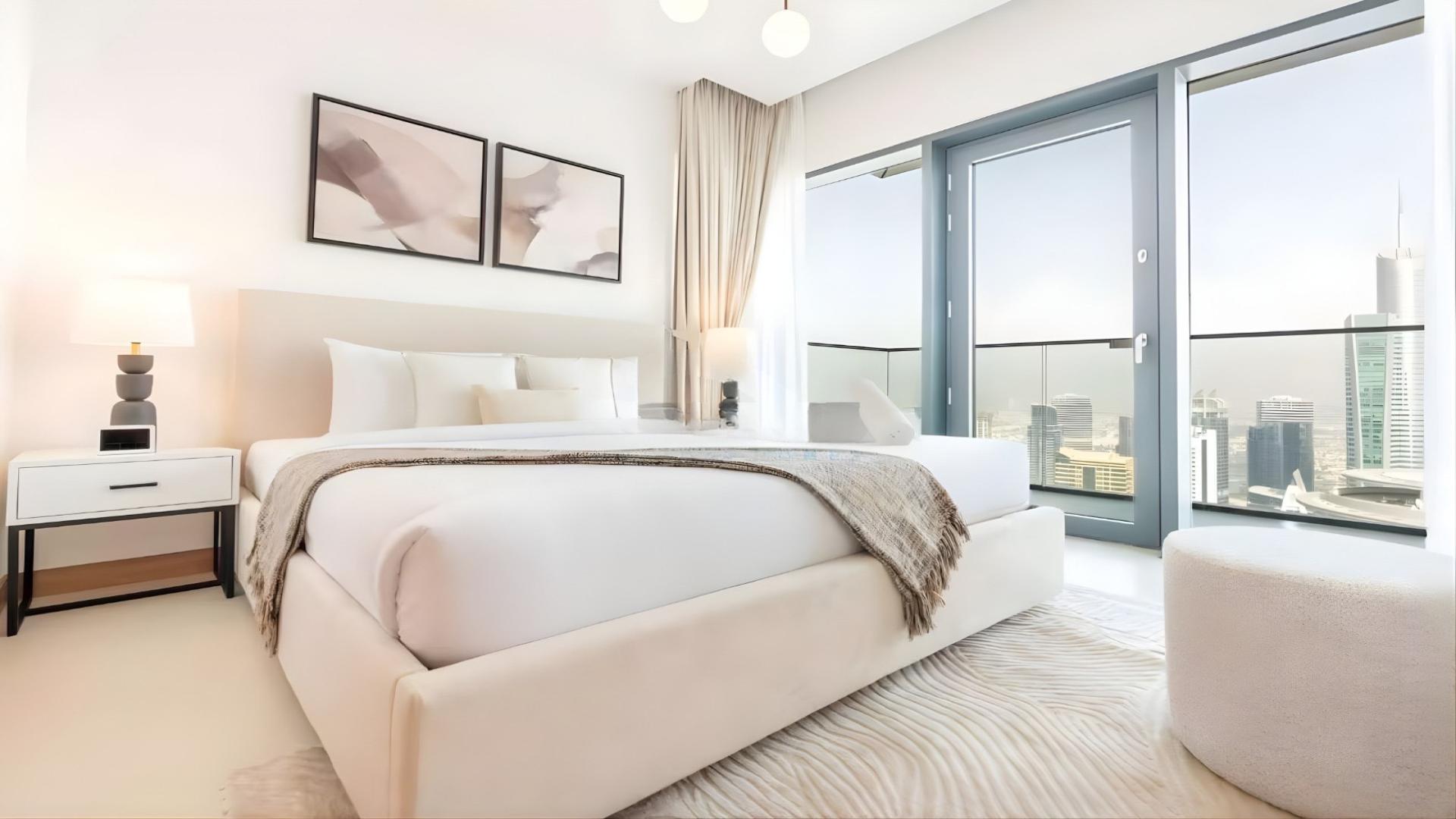 Modern living room in Vida Residences Dubai Marina apartment with city views and stylish decor