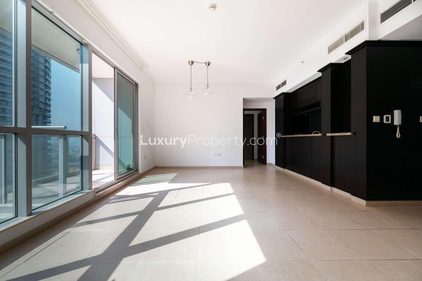 Spacious living room with large windows in Burj Residences apartment, Downtown Dubai