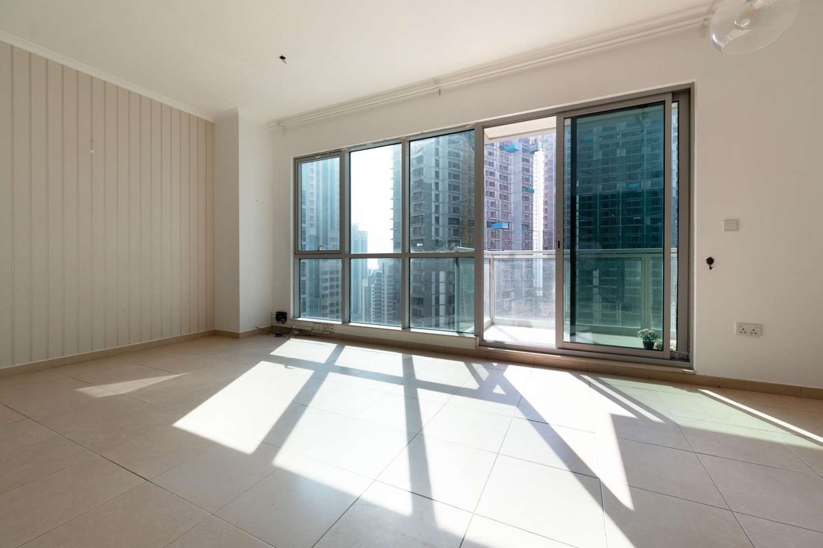Luxury kitchen in 1-bedroom apartment, Burj Residences, Downtown Dubai, featuring dark wood cabinets