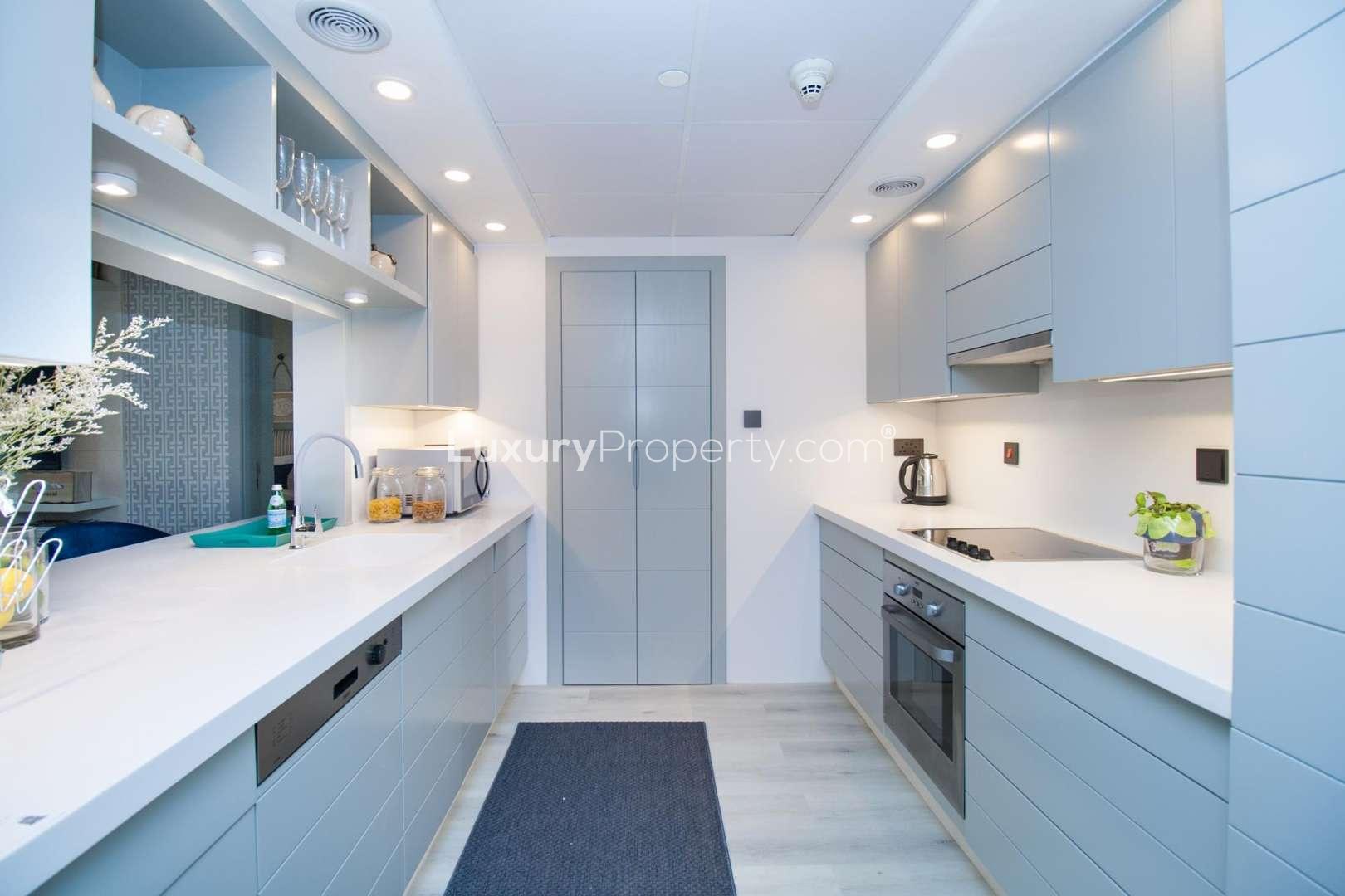 Modern living and dining area in luxury 1-bedroom apartment, Burj Views, Downtown Dubai